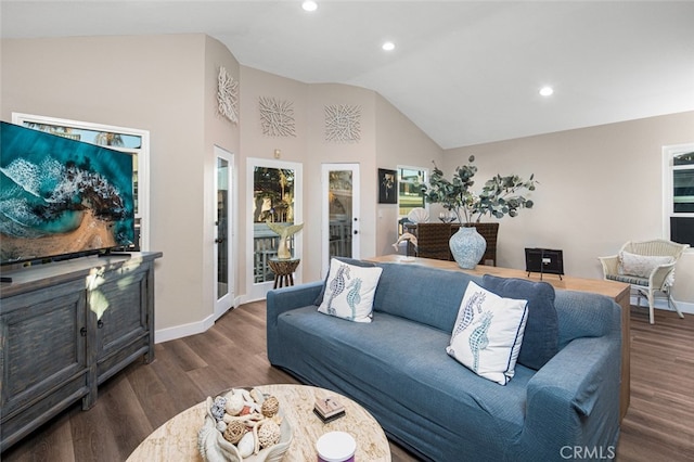 living room with dark hardwood / wood-style flooring and high vaulted ceiling