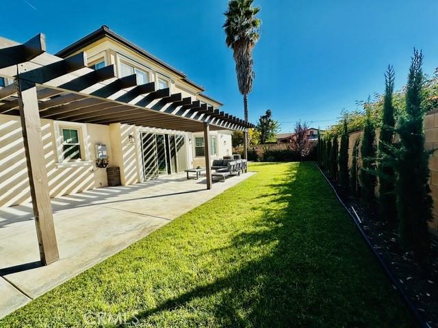 view of yard with a patio area and a pergola