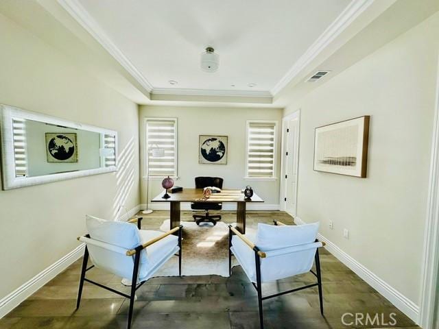 office space featuring dark hardwood / wood-style floors, a raised ceiling, and crown molding