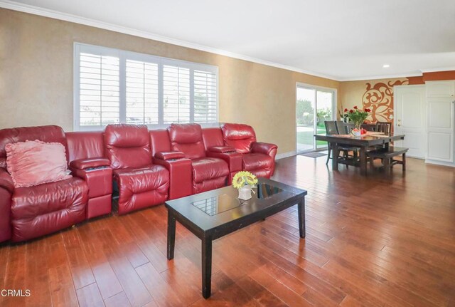 living room featuring ornamental molding and hardwood / wood-style flooring