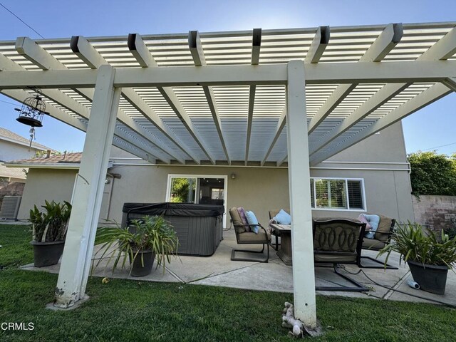 view of patio with outdoor lounge area, a hot tub, and a pergola