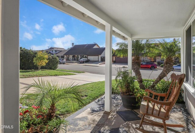 view of patio / terrace featuring a residential view and covered porch