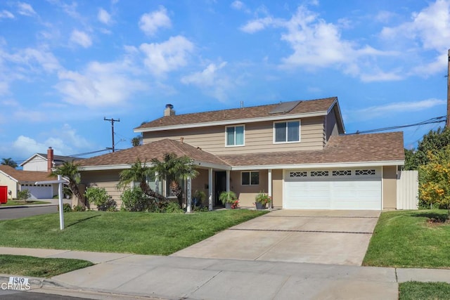 traditional home featuring roof with shingles, a front yard, a chimney, solar panels, and driveway
