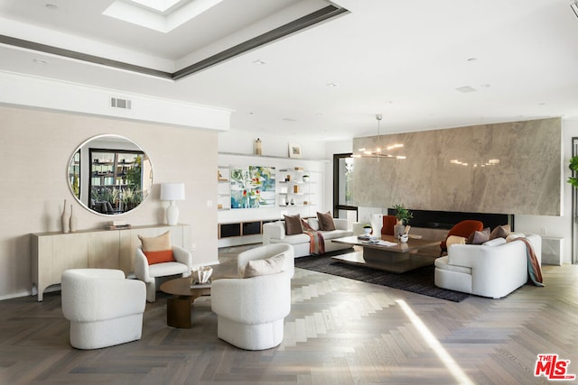 living room with parquet floors and a chandelier