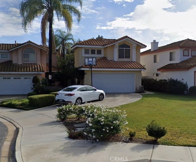 mediterranean / spanish home with a front yard and a garage