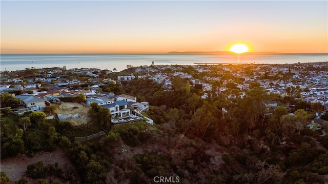 aerial view at dusk with a water view