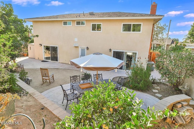 back of house featuring a patio area