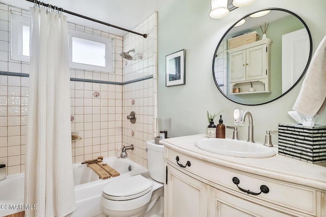 full bathroom featuring vanity, toilet, and shower / bath combo with shower curtain