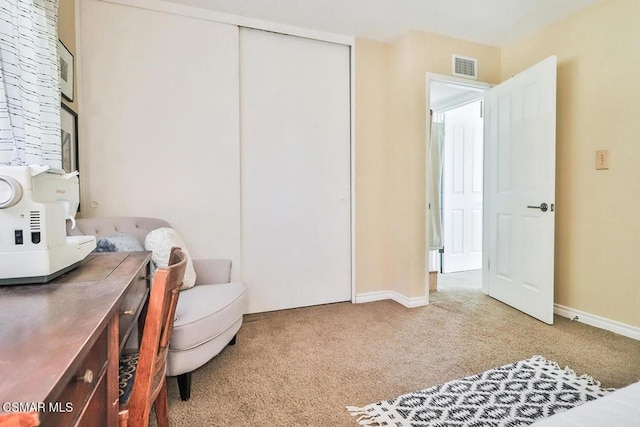 carpeted bedroom with a closet