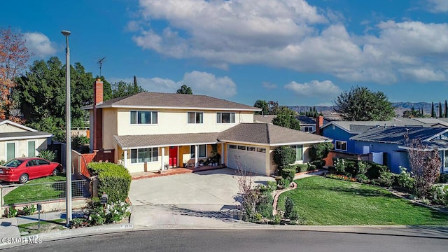 view of front facade featuring a garage and a front yard