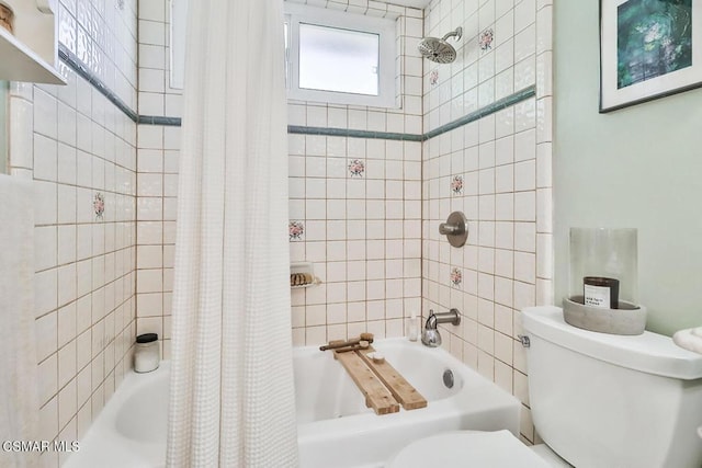 bathroom featuring shower / bath combination with curtain and toilet