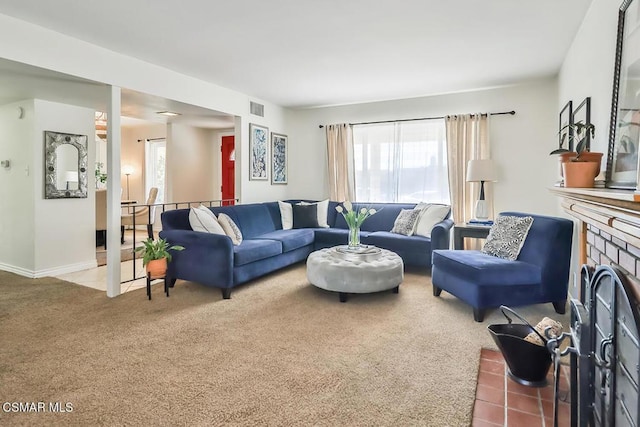 carpeted living room with a fireplace