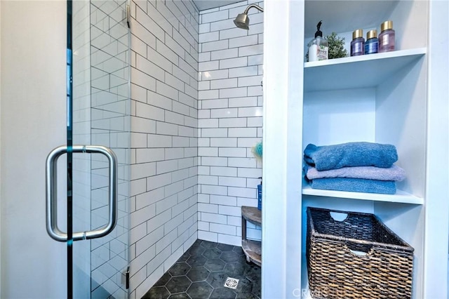 bathroom with tile patterned floors and an enclosed shower