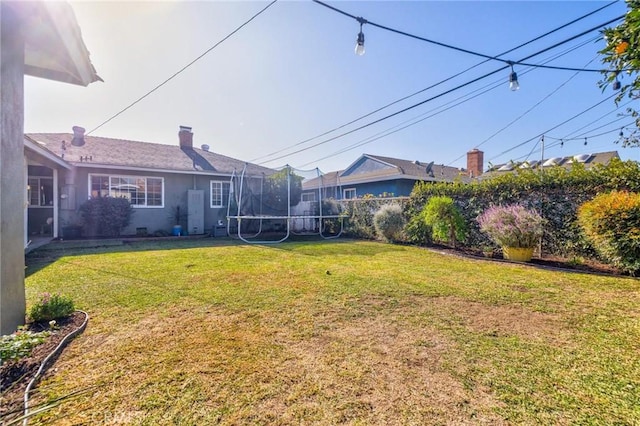 view of yard featuring a trampoline