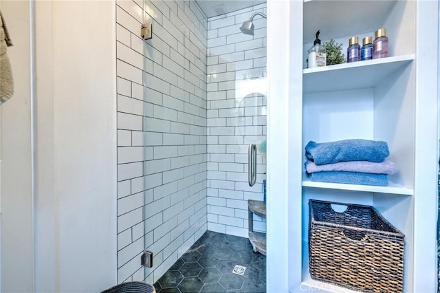 bathroom featuring tile patterned floors and an enclosed shower