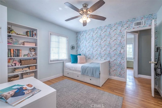 bedroom featuring light hardwood / wood-style floors and ceiling fan