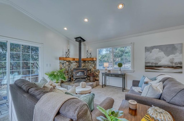 carpeted living room featuring a wood stove, lofted ceiling, and ornamental molding