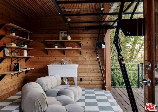 interior space with wood walls and wood ceiling