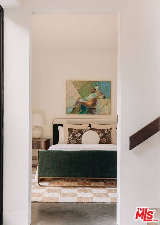 bedroom with concrete flooring