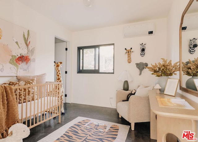 bedroom featuring a wall mounted air conditioner and a nursery area