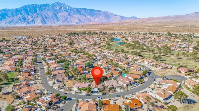 birds eye view of property with a mountain view