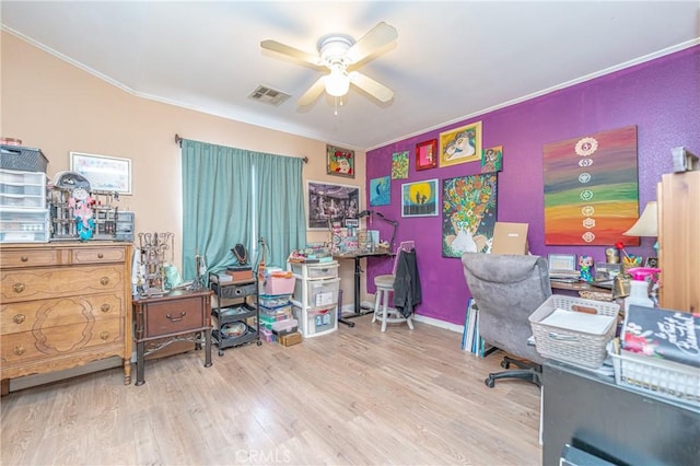 home office with ceiling fan, ornamental molding, and hardwood / wood-style flooring