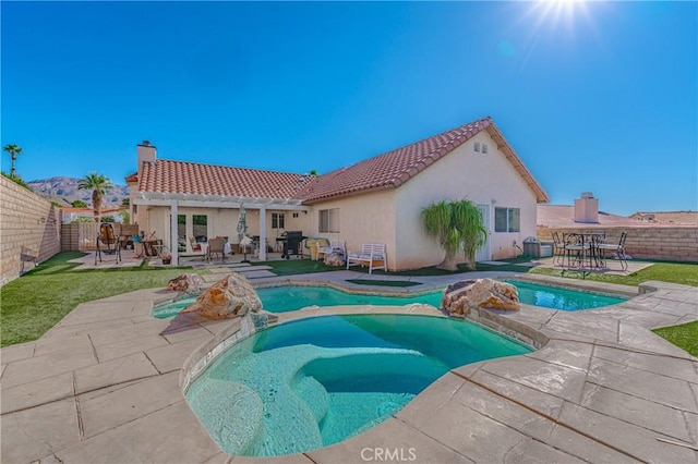 view of pool featuring an in ground hot tub, french doors, and a patio area