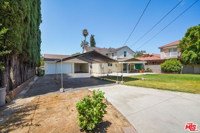 view of front facade with a garage and a front lawn