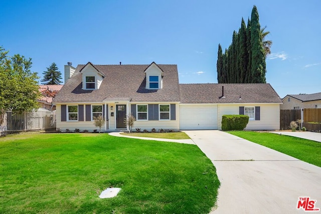 view of front of house with a garage and a front lawn