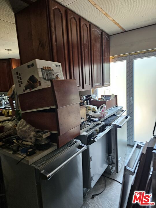 kitchen featuring dark brown cabinetry