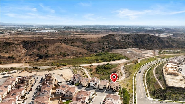 birds eye view of property featuring a mountain view