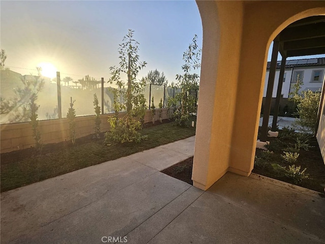 view of patio terrace at dusk