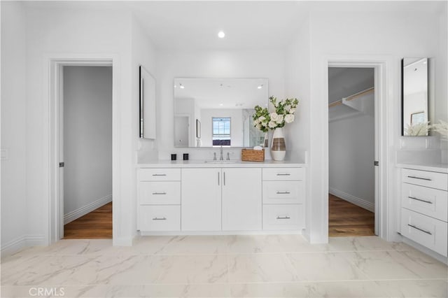 bathroom featuring vanity and hardwood / wood-style flooring