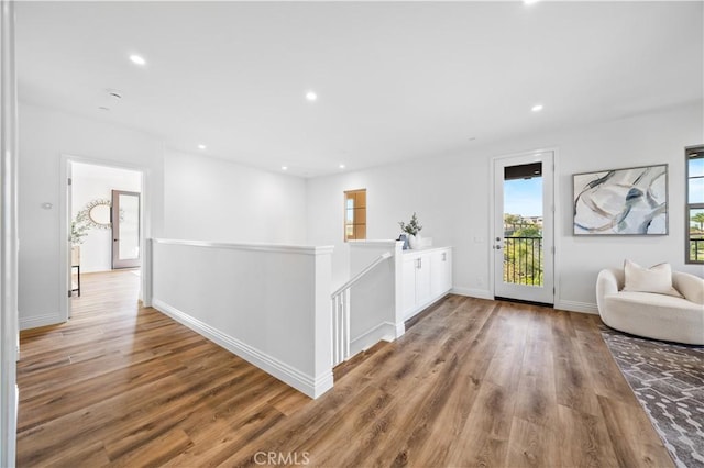 hallway with light hardwood / wood-style flooring