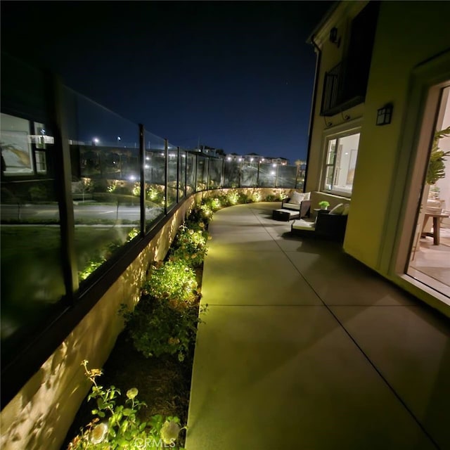 view of balcony at twilight