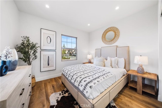 bedroom with dark wood-type flooring