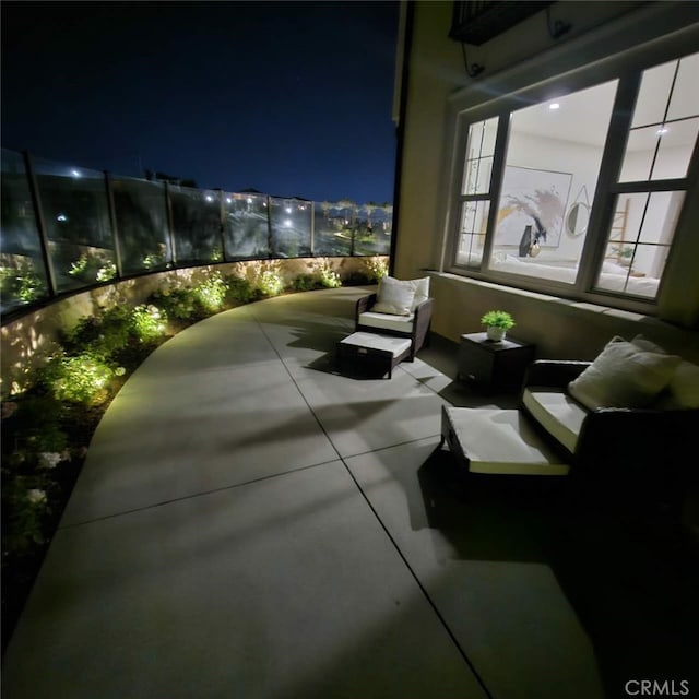 patio at twilight featuring outdoor lounge area