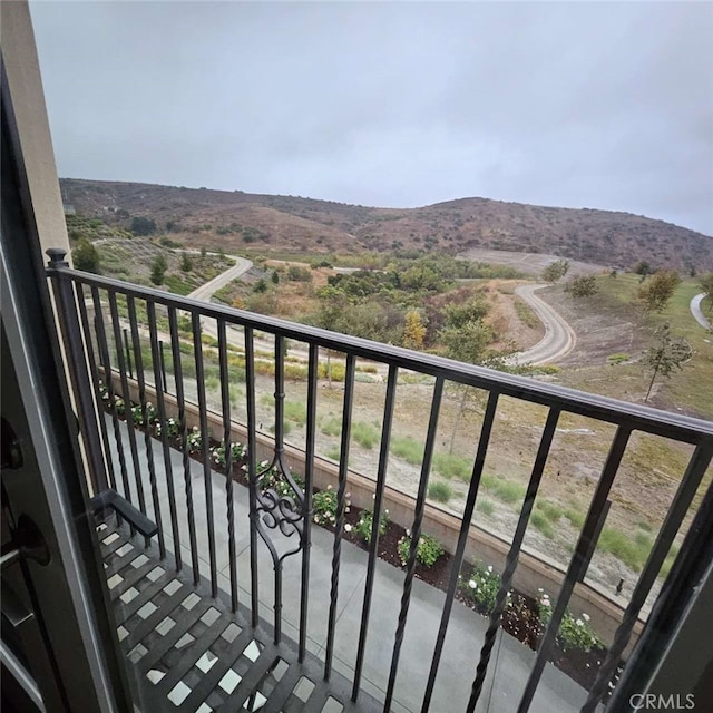 balcony featuring a mountain view