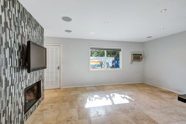 4615 Felton St Unit 2, San Diego, CA 92116 - unfurnished living room with a fireplace, recessed lighting, stone finish flooring, and a wall unit AC