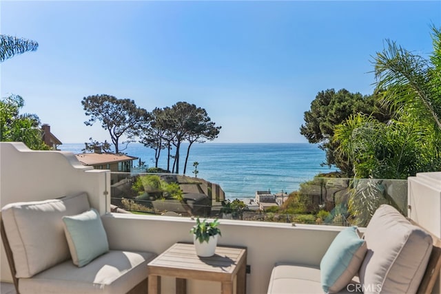 balcony featuring a water view