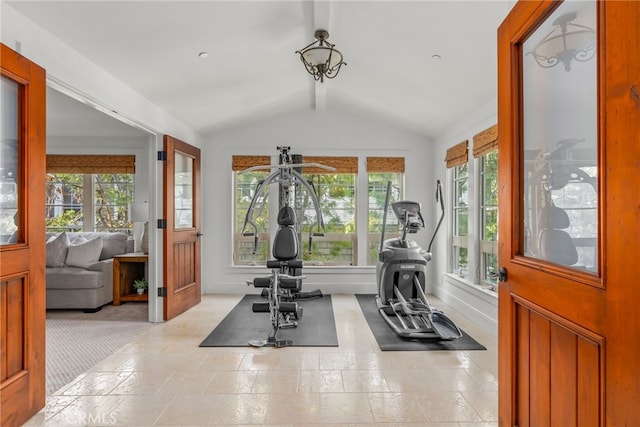 workout room featuring vaulted ceiling