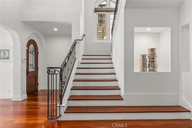 stairway featuring hardwood / wood-style flooring