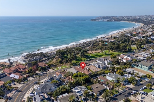 bird's eye view featuring a water view and a beach view