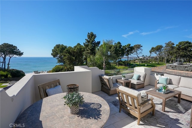 view of patio / terrace with a water view and an outdoor hangout area