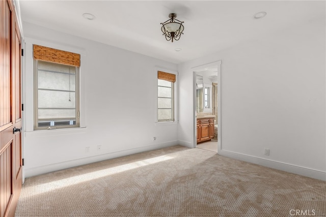 empty room featuring light carpet