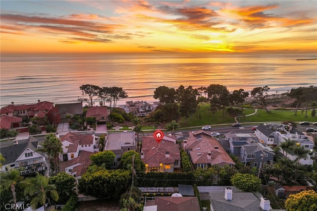 aerial view at dusk with a water view