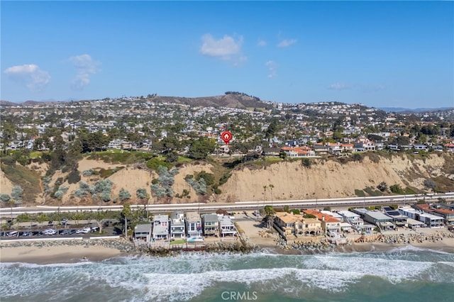 birds eye view of property with a water and mountain view