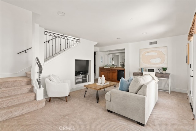 living room with light colored carpet