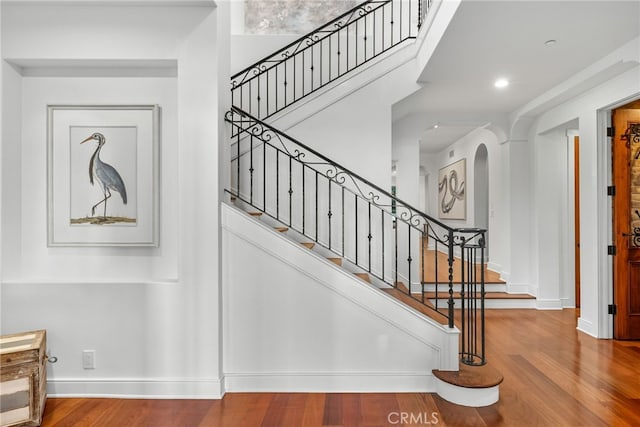 staircase featuring hardwood / wood-style flooring