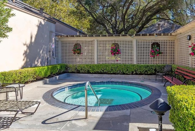 view of pool featuring a community hot tub